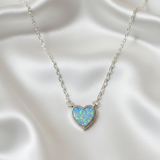 Iridescent Opal Heart Necklace on a Starcella Jewelry card.