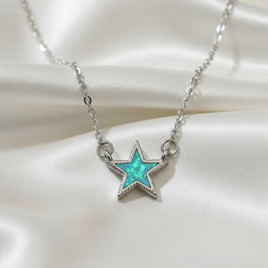 Iridescent Opal Star Necklace with turquoise stone and silver chain on a white background