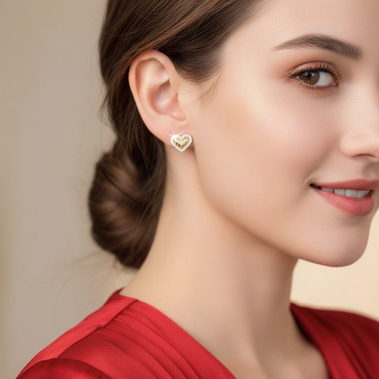 Gold Shimmer Heart Earrings worn by a person