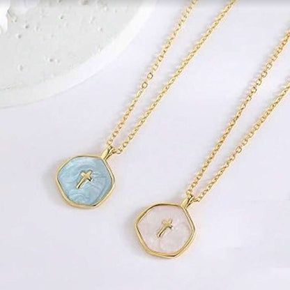 Two Walk in Faith Enamel Cross Necklaces with gemstone pendants on a light background