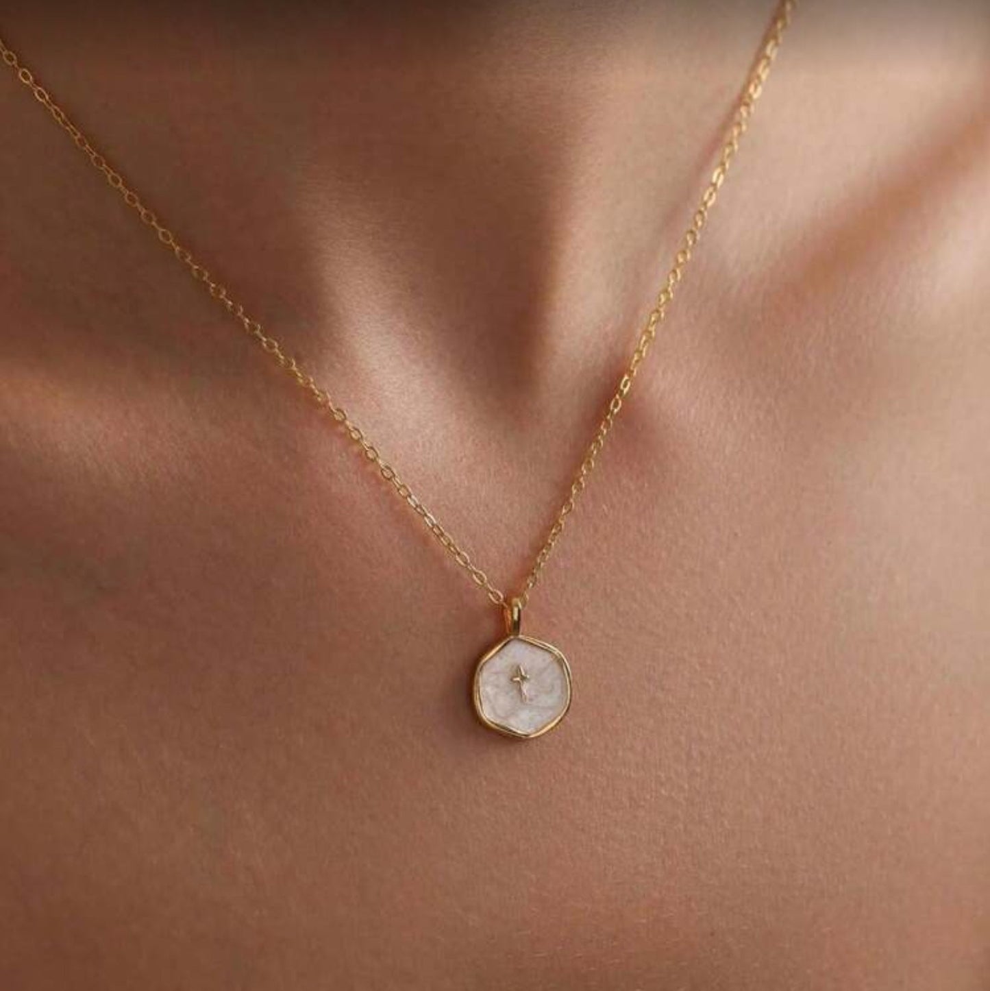 Walk in Faith Enamel Cross Necklace with a round pendant on a person's neck