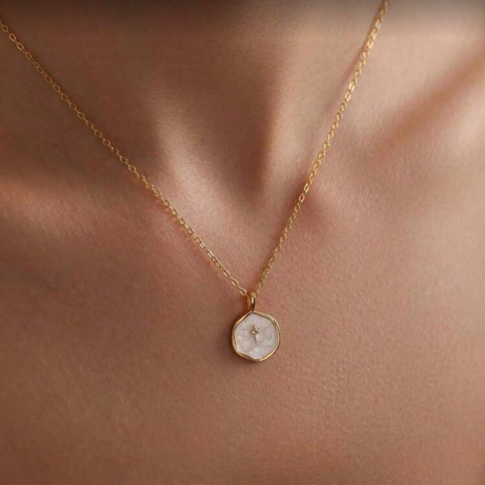 Walk in Faith Enamel Cross Necklace with a round pendant on a person's neck