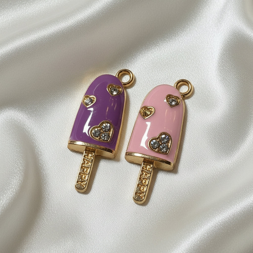 Two decorative Blush Grape Popsicle Duo (Purple & Pink) charms shaped like popsicles with pink and purple colors on a gray background.