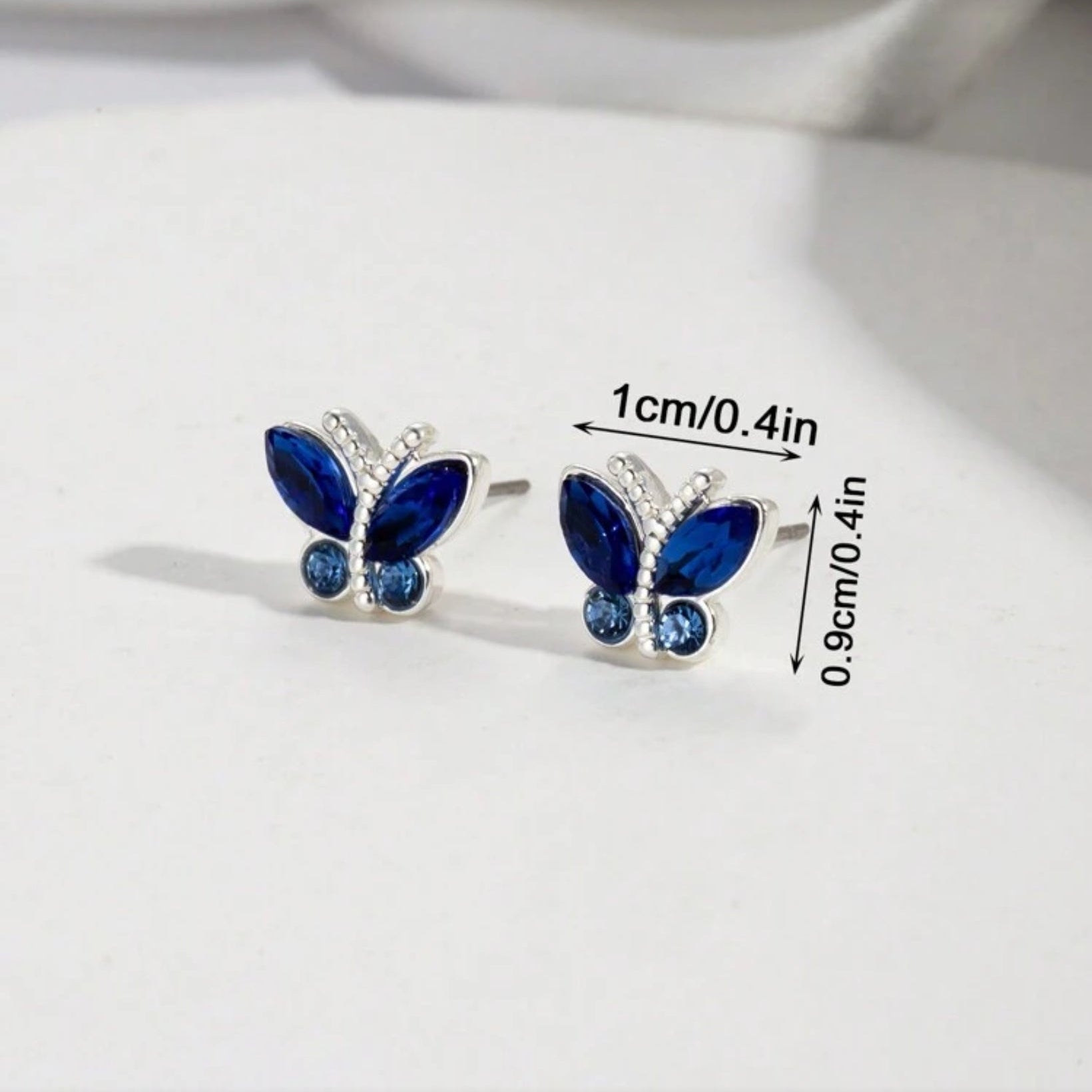 Midnight Blue Butterfly Stud Earrings on a white background, showing measurements.