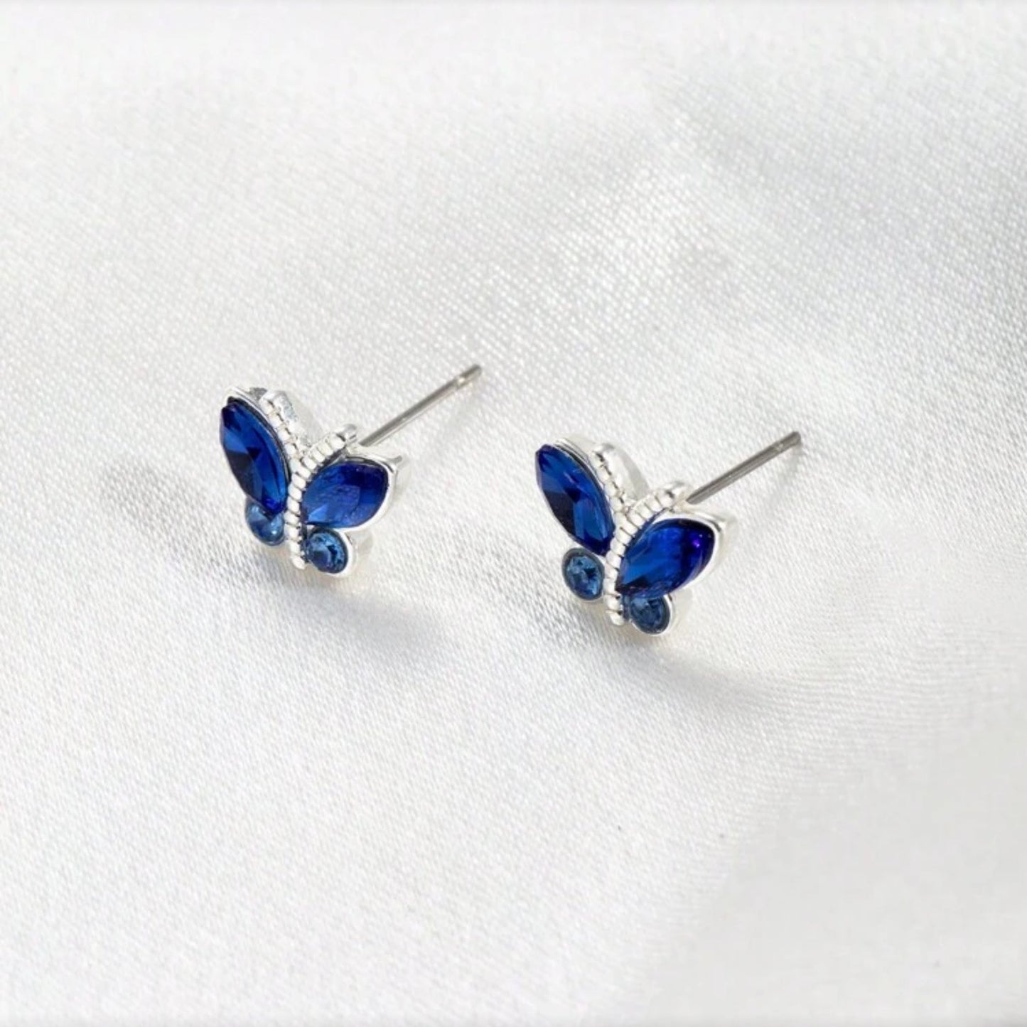 Midnight Blue Butterfly Stud Earrings on a white background