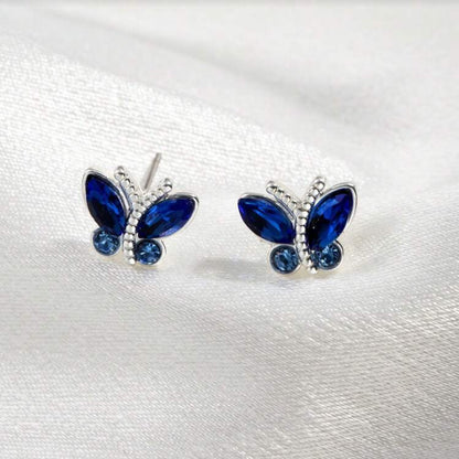 Midnight Blue Butterfly Stud Earrings with blue gemstones on a white background