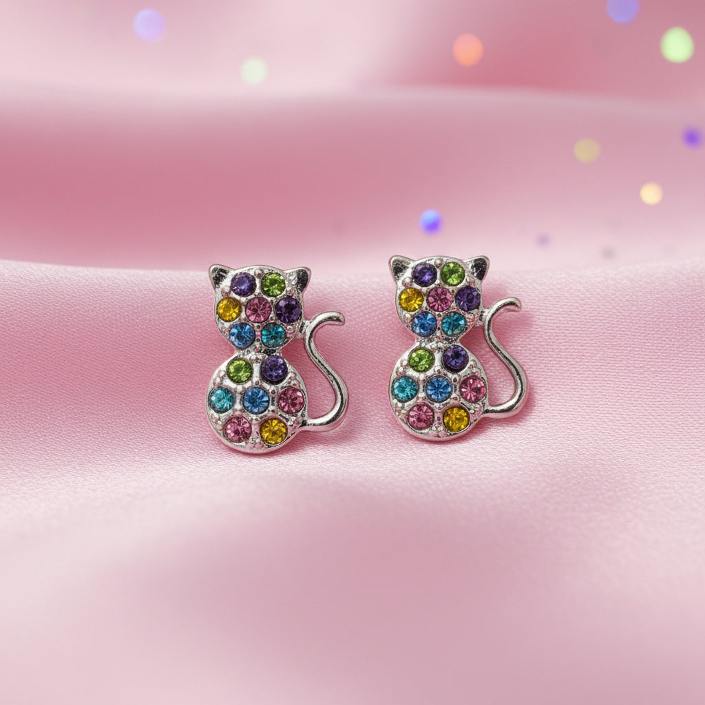 Multicolor Pavé Cat Earrings on a pink background