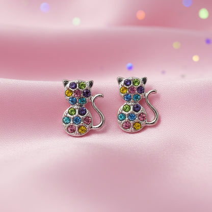 Multicolor Pavé Cat Earrings on a pink background