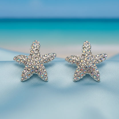 Iridescent Starfish Sparkle Earrings with rhinestones in a beach setting