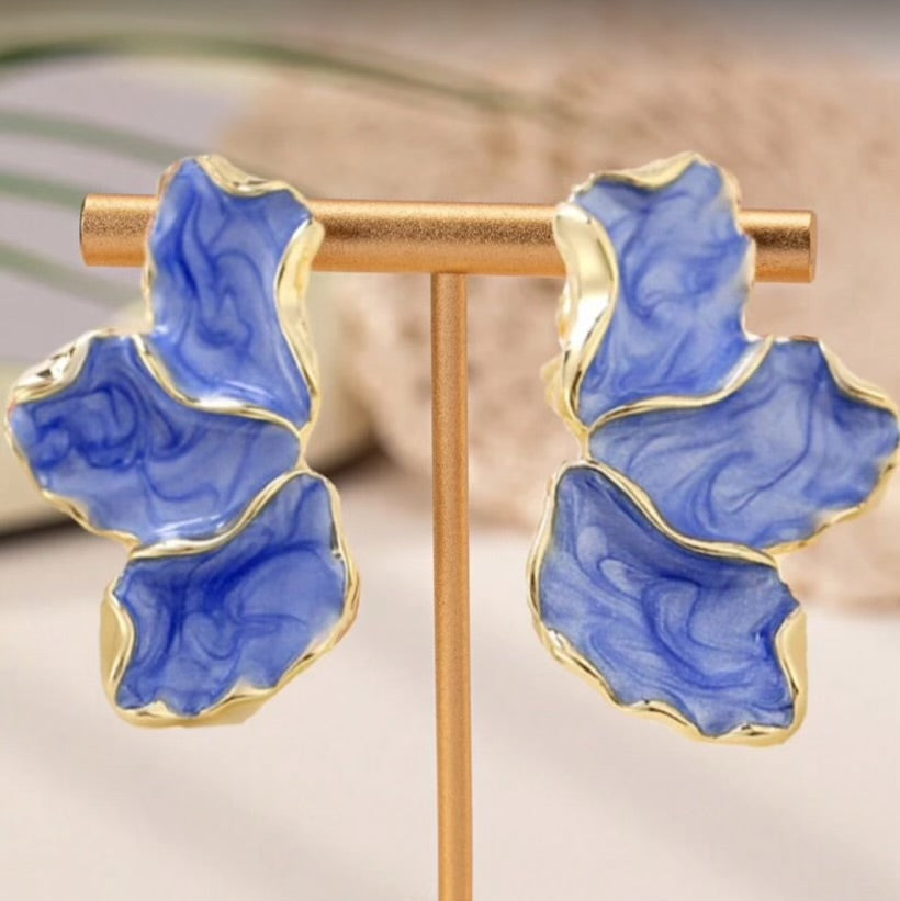 Blue Marble Petal Earrings on a stand