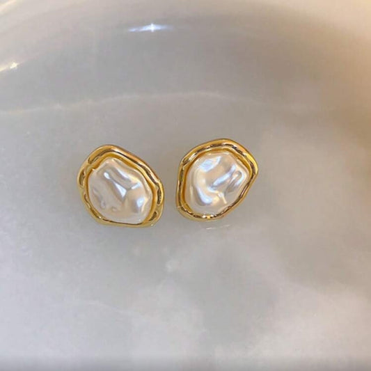 Iridescent Glow Pearl Studs on a white background