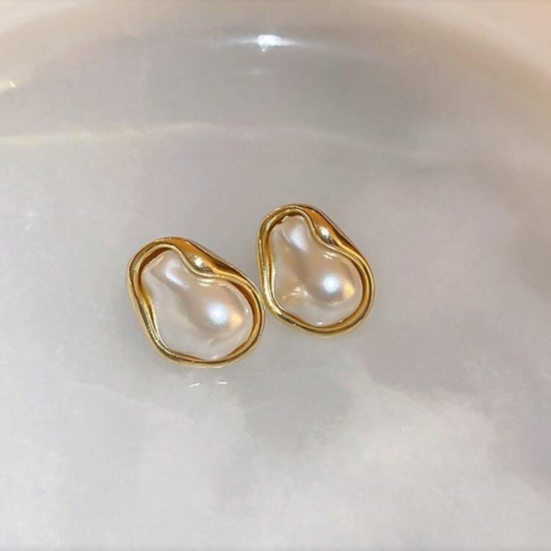 Iridescent Glow Pearl Studs on a white background