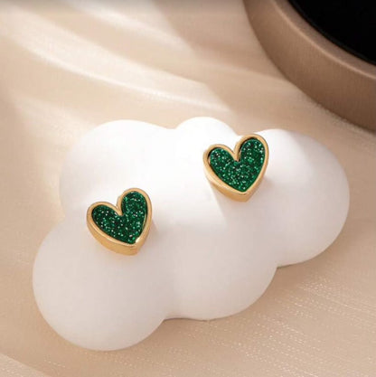 Green Glitter Heart Earrings on a white cloud-shaped stand.