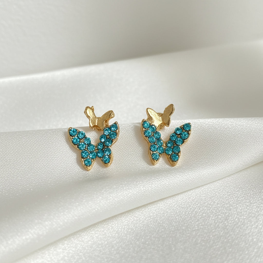 Petite Turquoise Double Butterfly Gold Zircon Earrings on white background