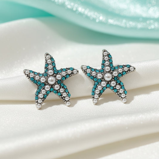 Ocean Pearl Pavé Starfish Earrings with aqua and pearl details on a white background