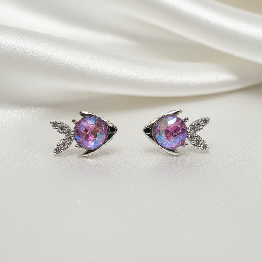 Mini Silver Opalescent Fish Earrings on white background