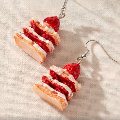 Strawberry Shortcake Layer Earrings on a light fabric background
