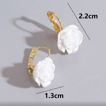 White Rose Earrings with white floral charms on a gray background, showing measurements.