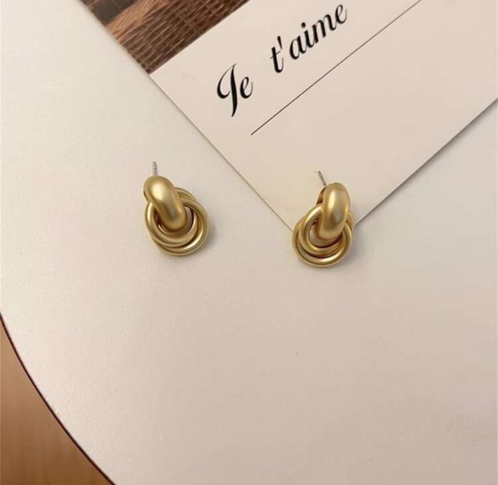Satin Gold Hoop Earrings on a card with 'Je t'aime' text