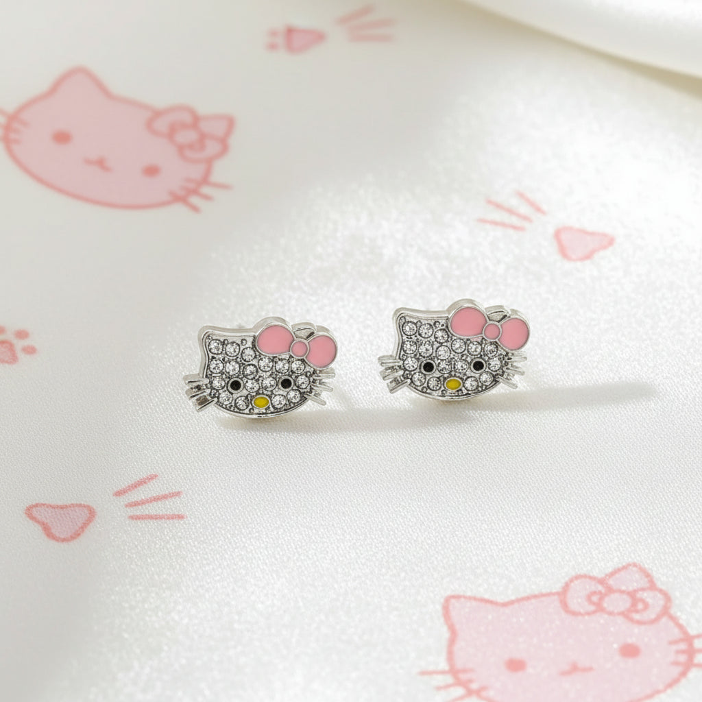 Pink Bow Kitty Pavé Earringswith pink accents on a white surface with pink graphics