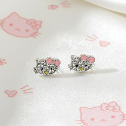 Pink Bow Kitty Pavé Earringswith pink accents on a white surface with pink graphics