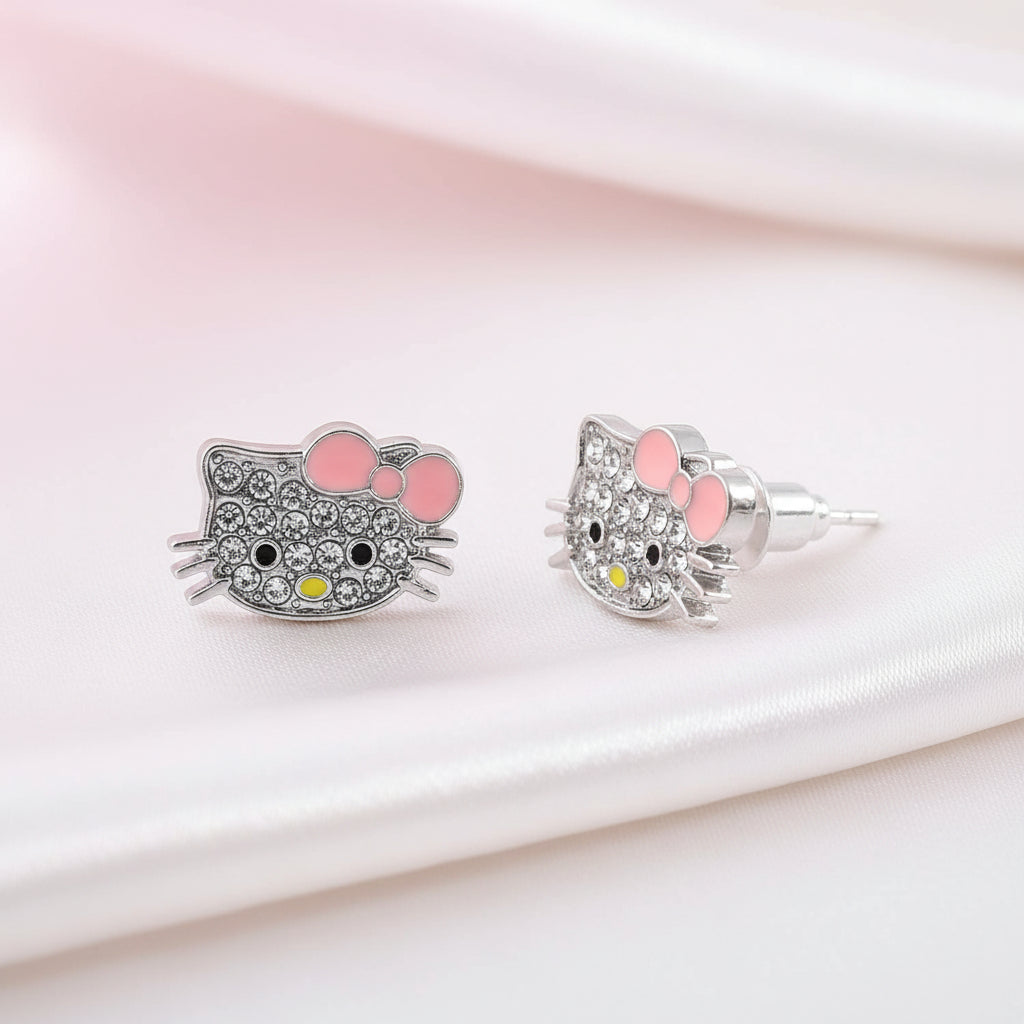 Pink Bow Kitty Pavé Earrings on a soft pink background