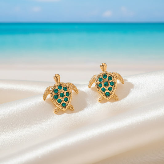 Green Crystal Sea Turtle Earrings on beach