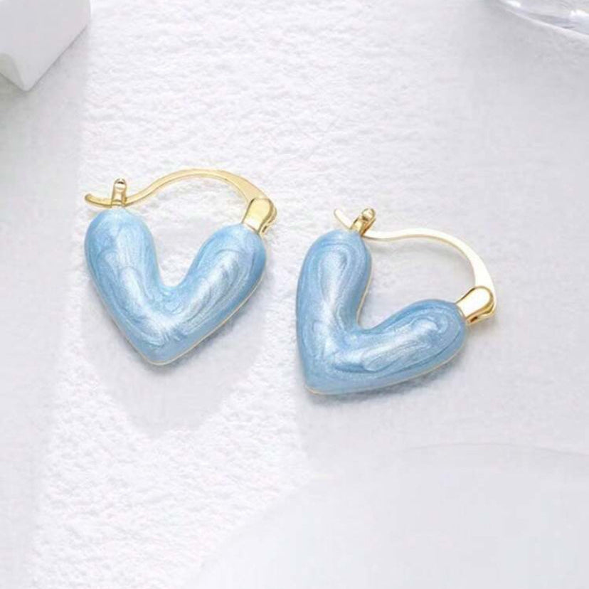Blue Stone Heart Earrings on a white background