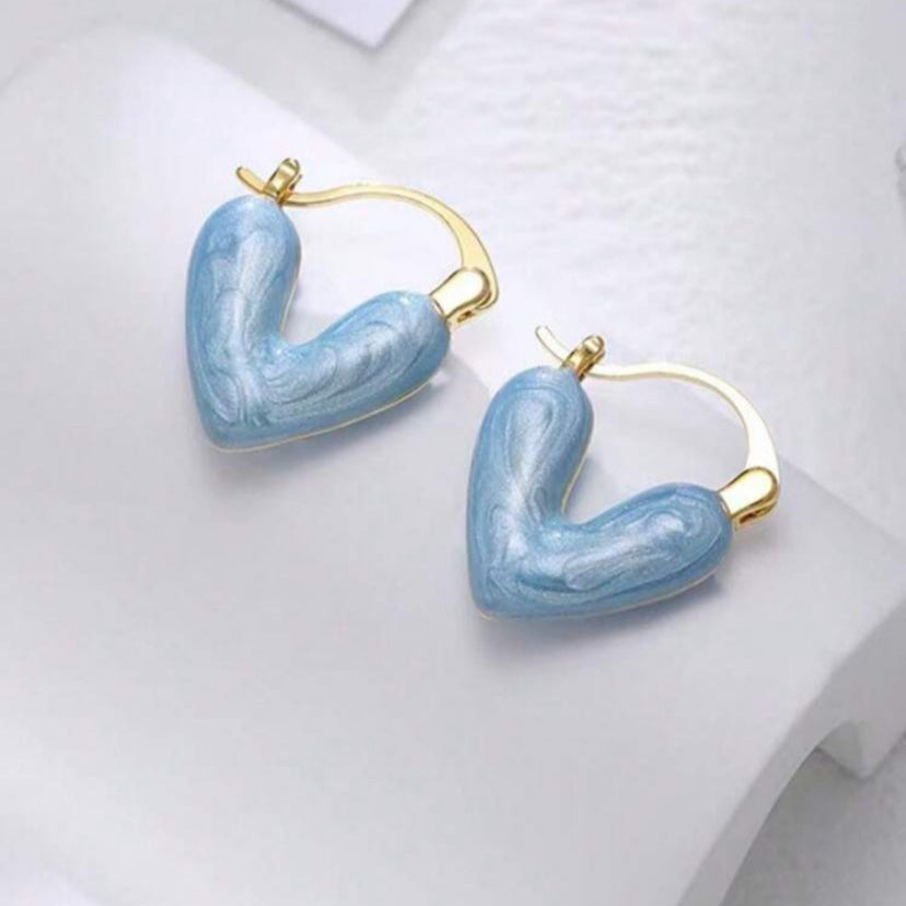 Blue Stone Heart Earrings with gold accents on a white background