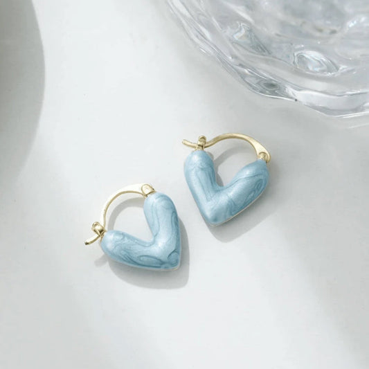 Blue Stone Heart Earrings on a white background