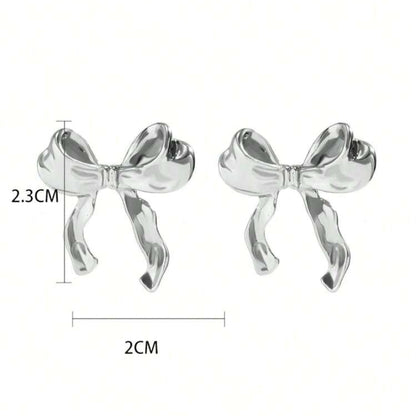 Silver Bow Ribbon Earrings with measurements on a white background