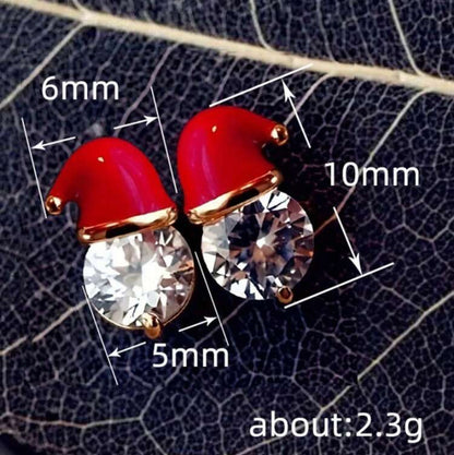 Starlit Santa Earrings on a leaf background, showing measurements.