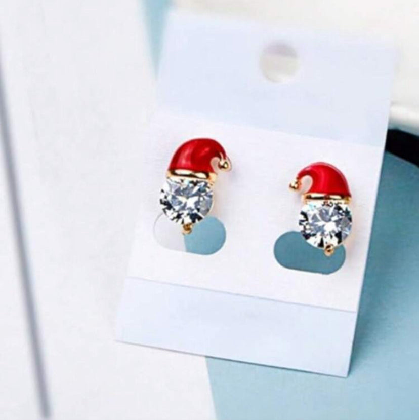 Starlit Santa Earrings on a display card with a light blue background