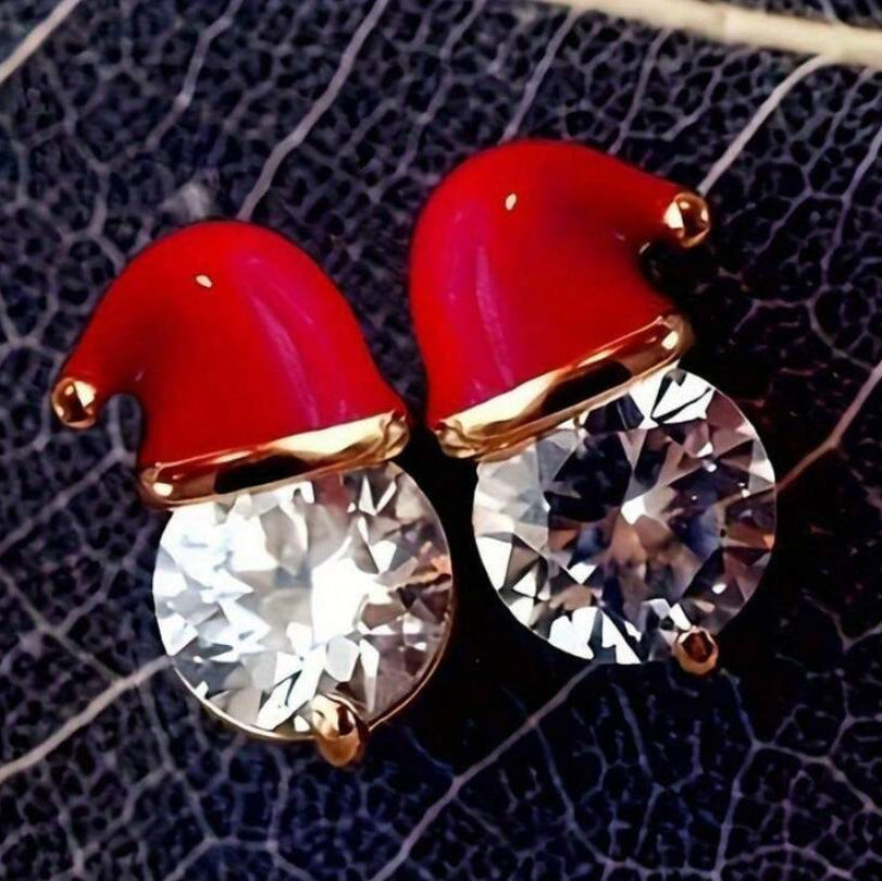 Starlit Santa Earrings on a textured black background