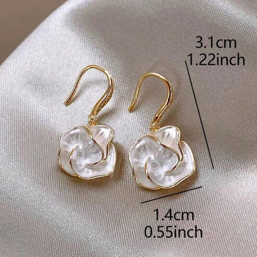 Golden Edge Pearl Drop Earrings with white stones on a light fabric background, showing measurements.