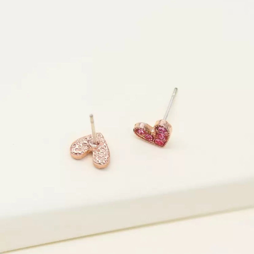 Petite Pink Zircon Heart Earrings with pink and red stones on a white background