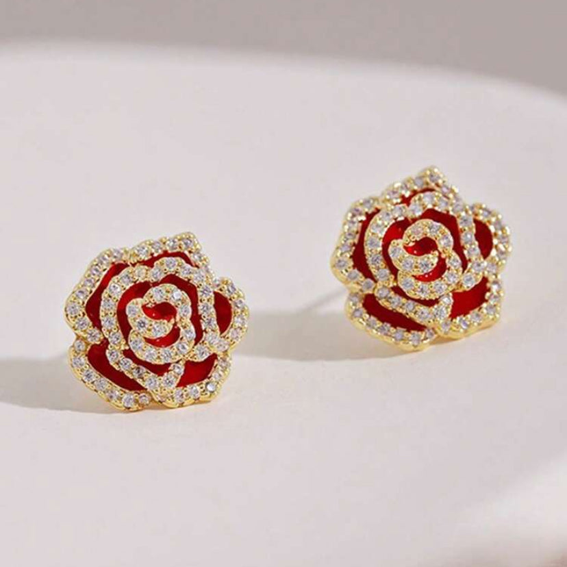 Rhinestone Rose Earrings with gold accents on a light background