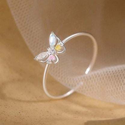 Pastel Butterfly Adjustable Ring on a beige background