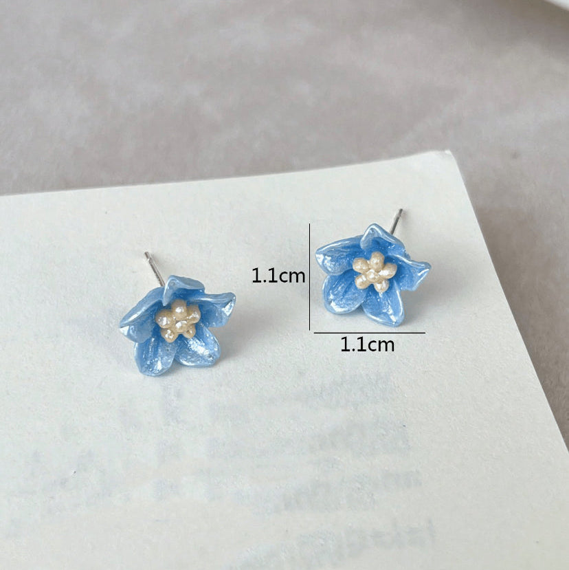 Blue Petal Blossom Earrings with pearl centers on a white surface, with measurements