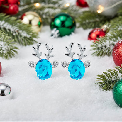 Crystal Blue Reindeer Earrings with blue gemstones on a white background