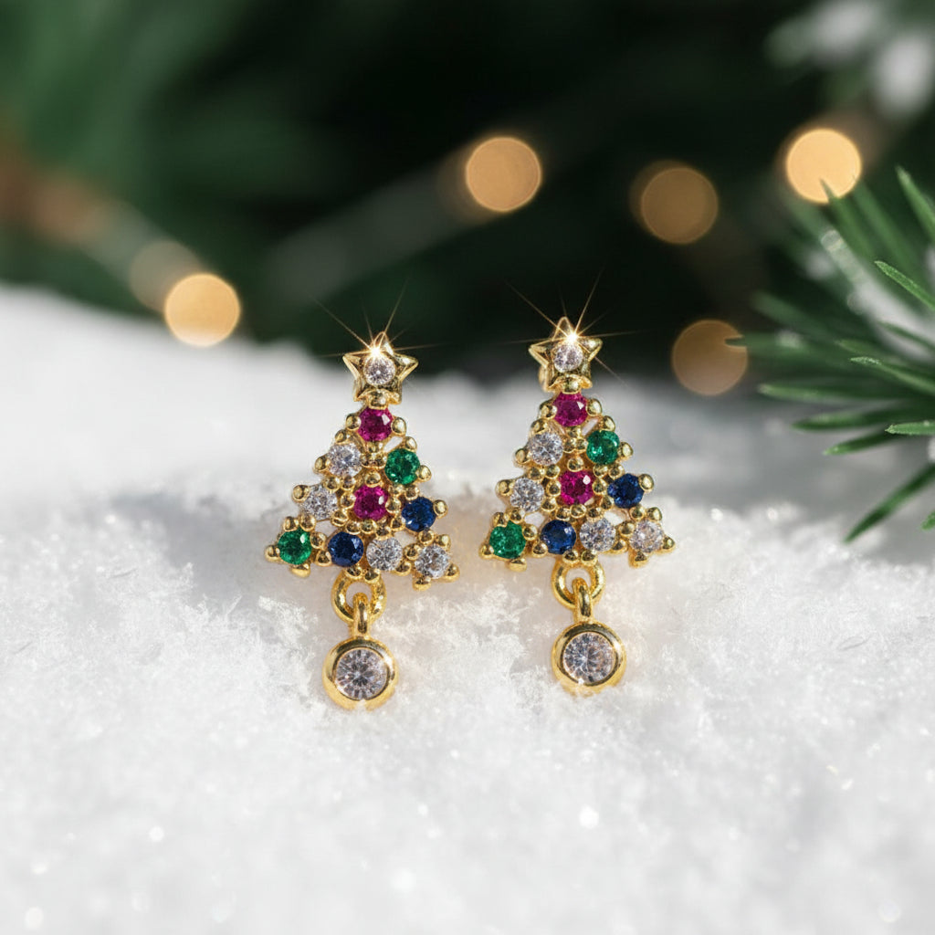 Twinkling Christmas Tree Earrings on a white surface