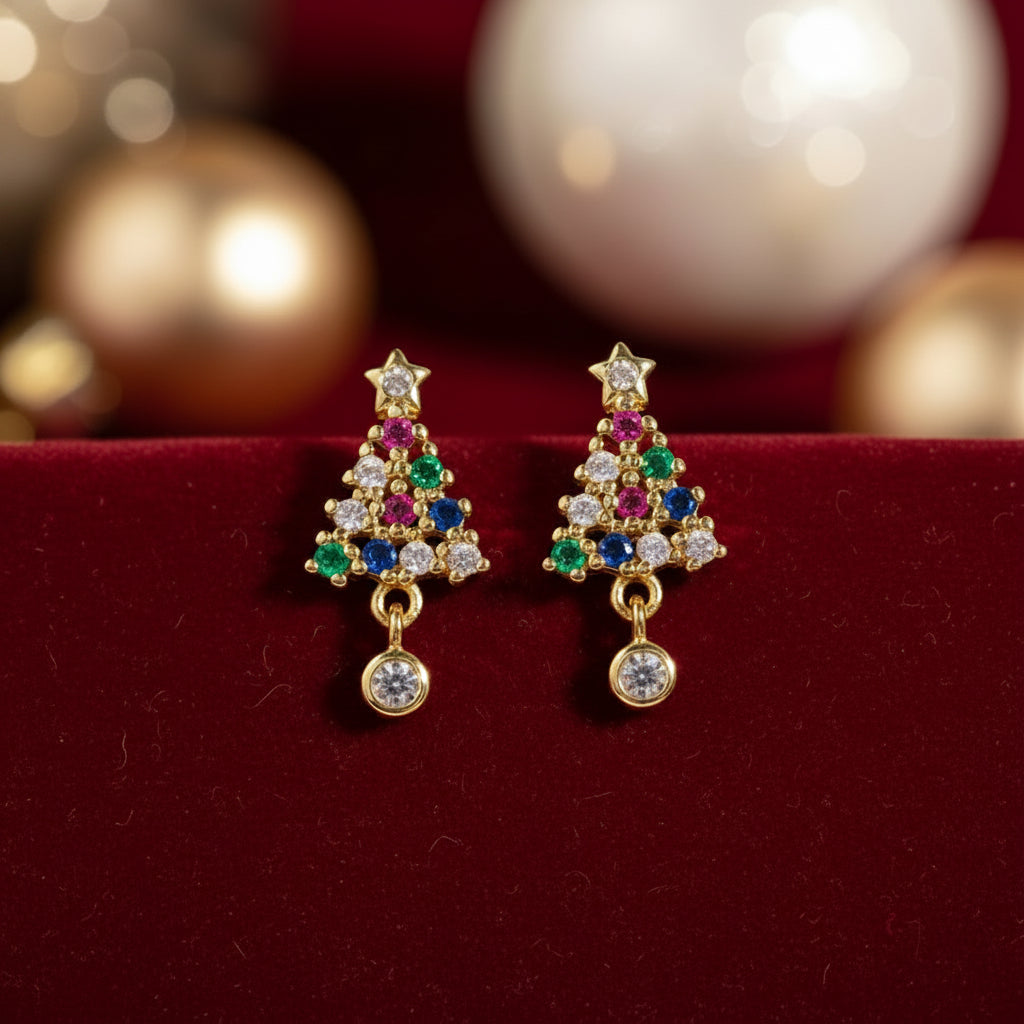 Twinkling Christmas Tree Earrings with colorful gemstones on a white surface