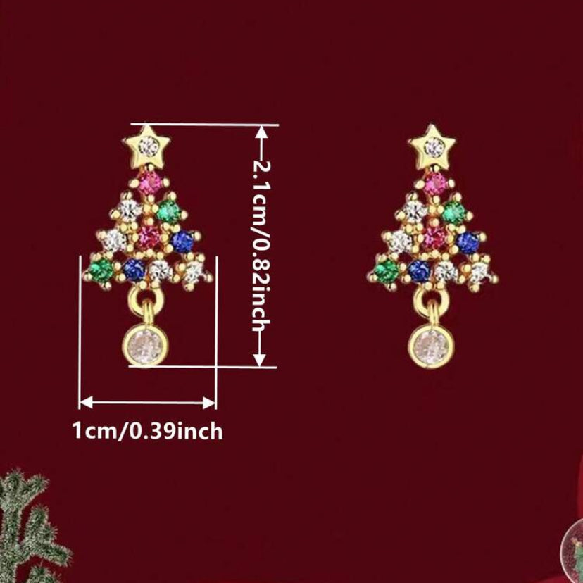 Twinkling Christmas Tree Earrings with colorful gemstones on a red background