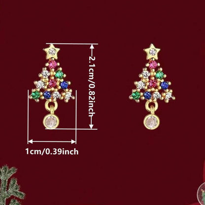 Twinkling Christmas Tree Earrings with colorful gemstones on a red background
