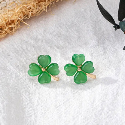 Gold and Green Four-Leaf Clover Shamrock Earrings on a white background