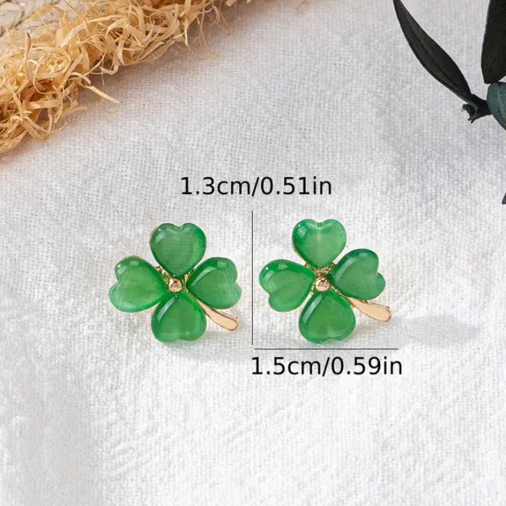 Gold and Green Four-Leaf Clover Shamrock Earrings with size measurements on a white background