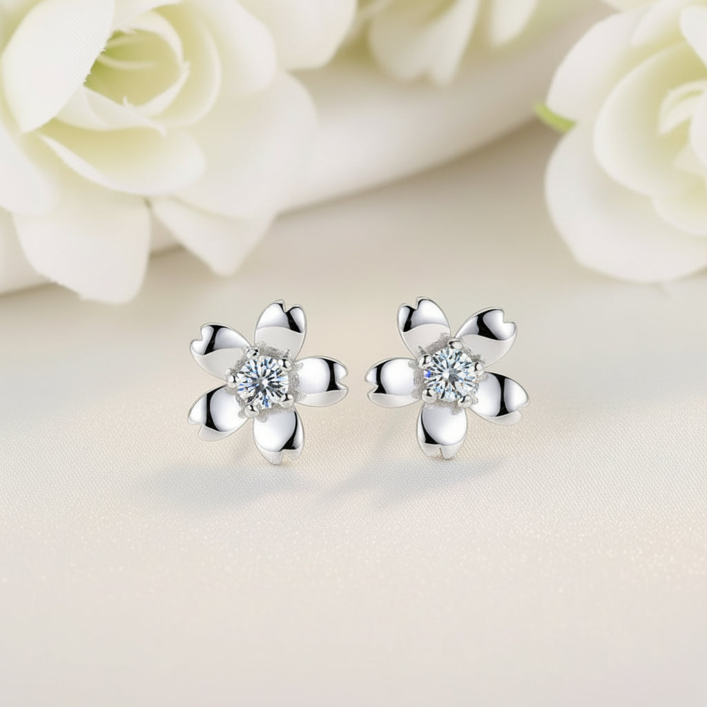 Silver Zirconia Flower Earrings with clear gemstones on a soft background