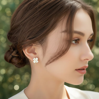 Close-up of a person wearing an Opalescent Clover Earring with a blurred background