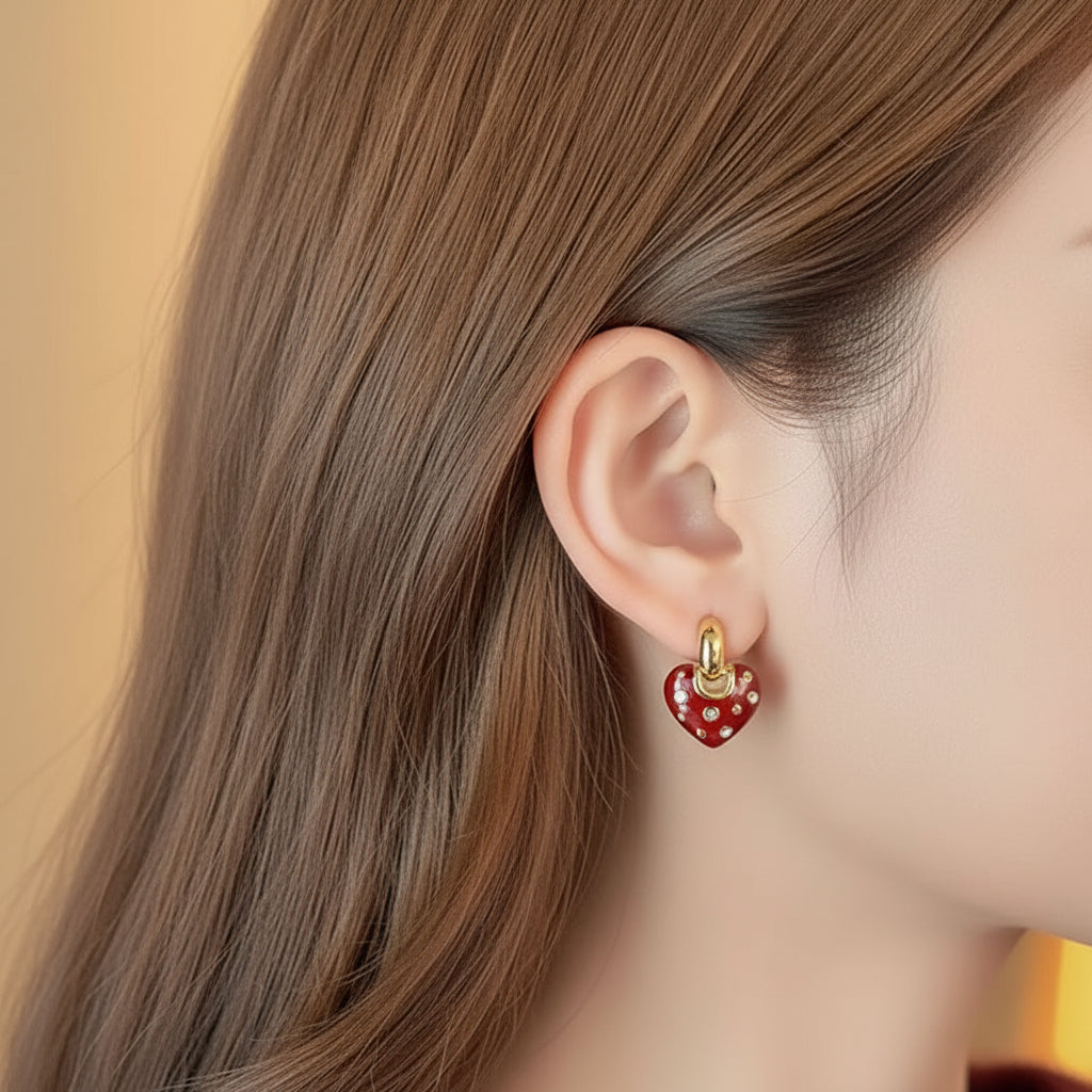 Close-up of a person wearing a Crystal Accent Red Heart Earring
