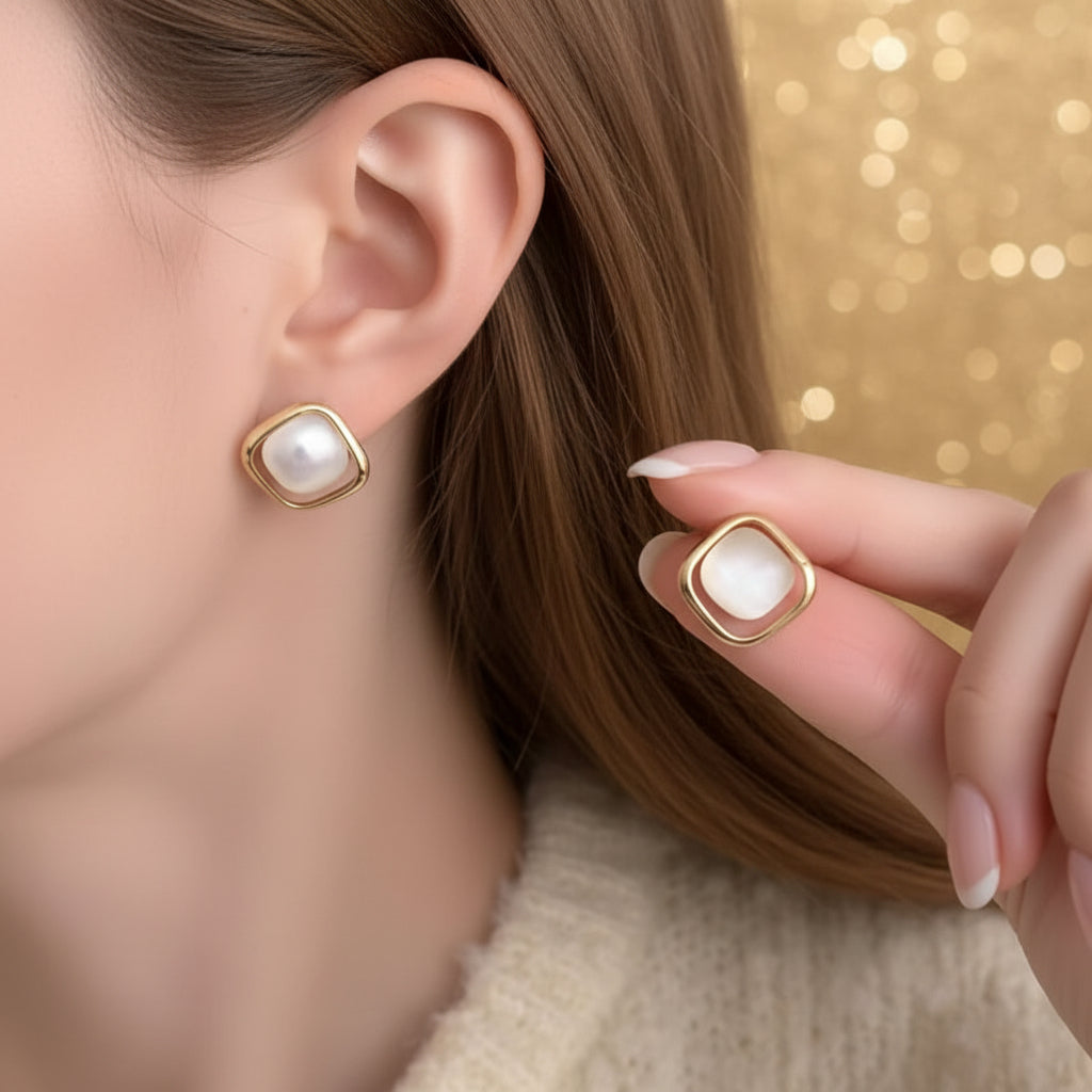Pearl Square Stud Earrings with a central stone worn by a person.